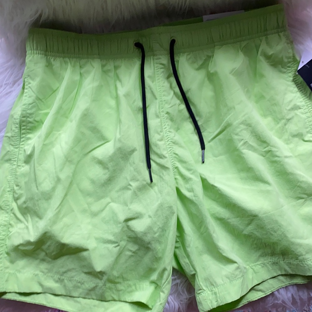 Neon green swimming trunks